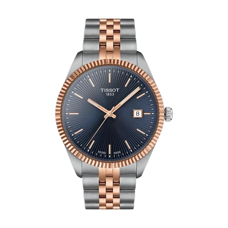 TISSOT Ballade watch with blue dial, fluted bezel, rose gold PVD case and stainless steel bracelet.